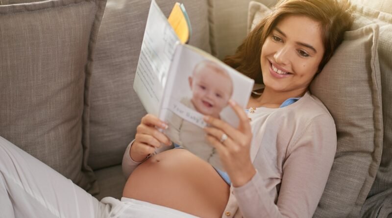 Woman,,Happiness,And,Pregnancy,Book,On,Couch,For,Research,,Planning